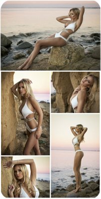        / Girl in a white bathing suit on the beach - Stock Photo